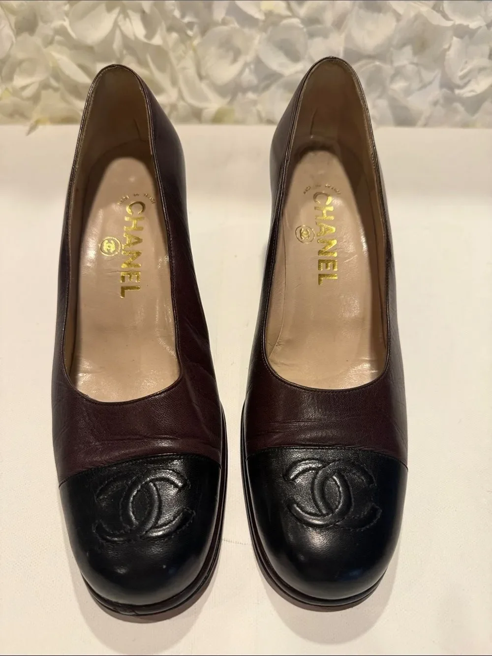 CHANEL Two-Tone Black and Burgundy Leather Cap-Toe Pumps